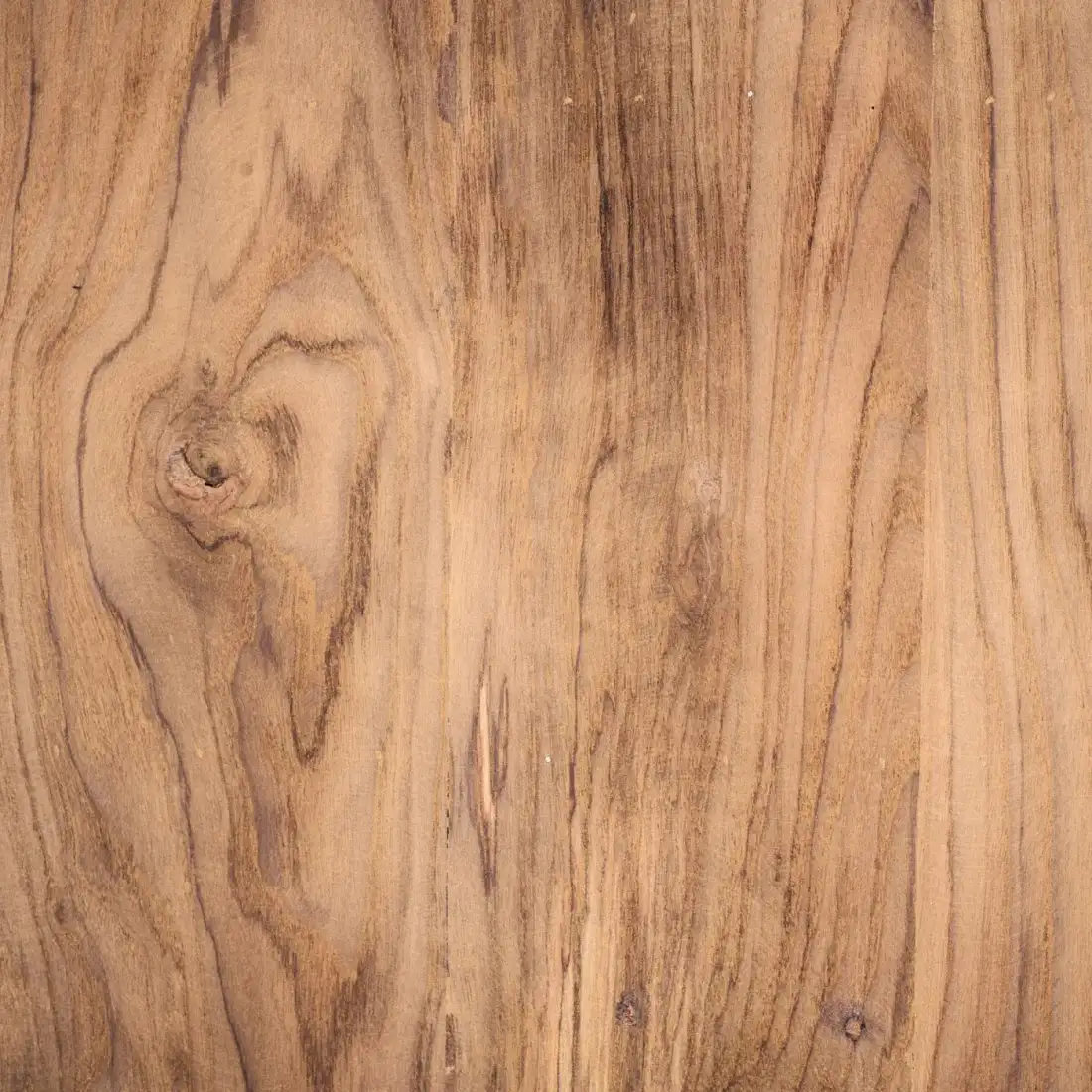 Close view of timber grain with a knot and long dark lines